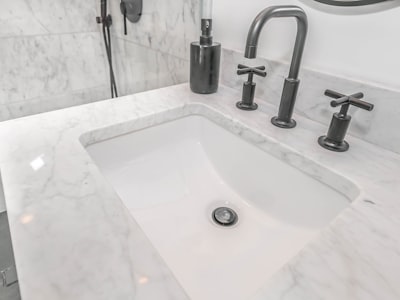 Modern bathroom faucet and marble countertop installation