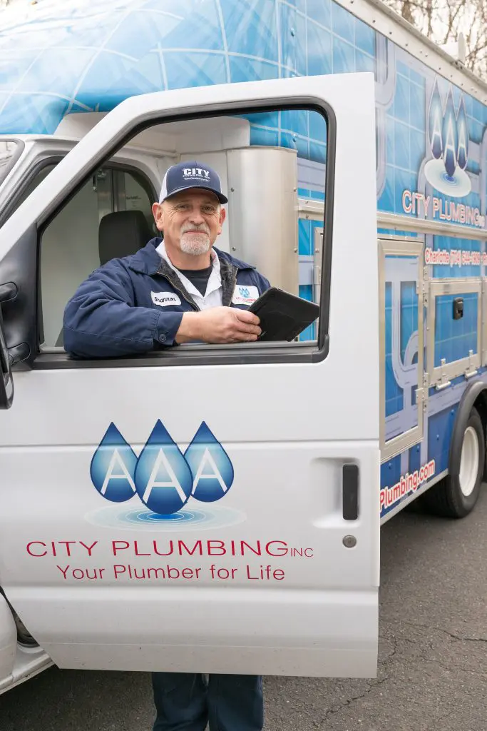 AAA City Plumbing veteran technician by service truck